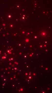 Siyah bir arkaplanda parlayan kırmızı parçacıkların canlandırması