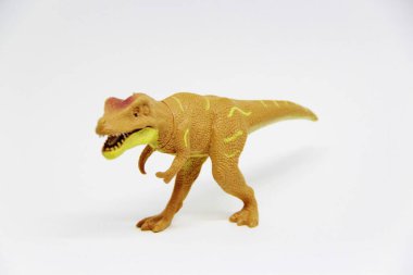 Beyaz arka planda izole edilmiş plastik dinozor oyuncağı