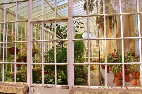 View of architecture, facades of buildings, and garden of the palace complex Quinta da Regaleira, Sintra, Portugal