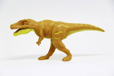 Beyaz arka planda izole edilmiş plastik dinozor oyuncağı