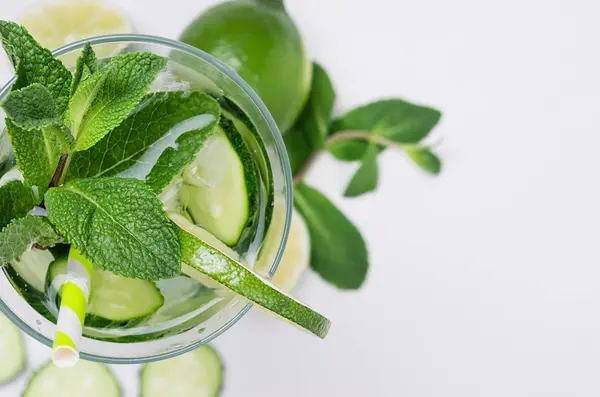 Cold Beverage Ice Cubes Slices Lime Cucumber Straw Twigs Mint — Stock Photo, Image