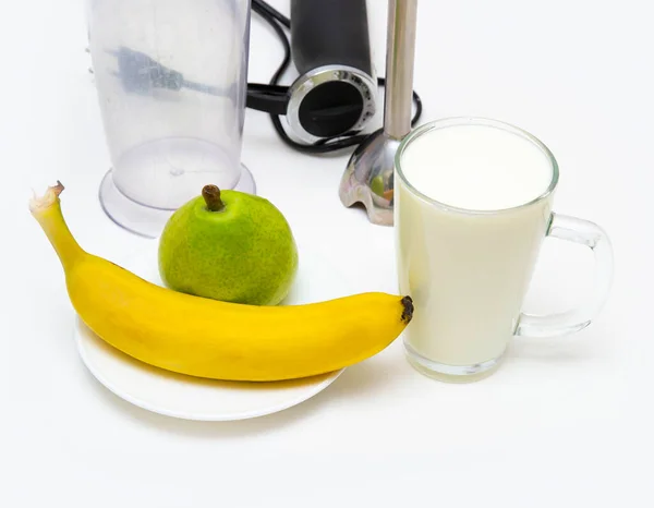 step 1, on the table is white yogurt, banana, pear, blender. making banana and pear smoothie yogurt. healthy eating.