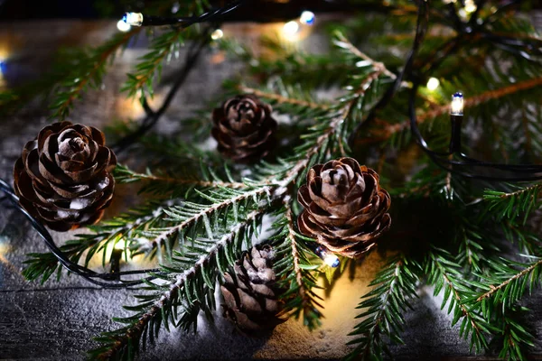 Cones Branches Christmas Tree Lights Garlands Sprinkled Little Snow Concept — Stock Photo, Image