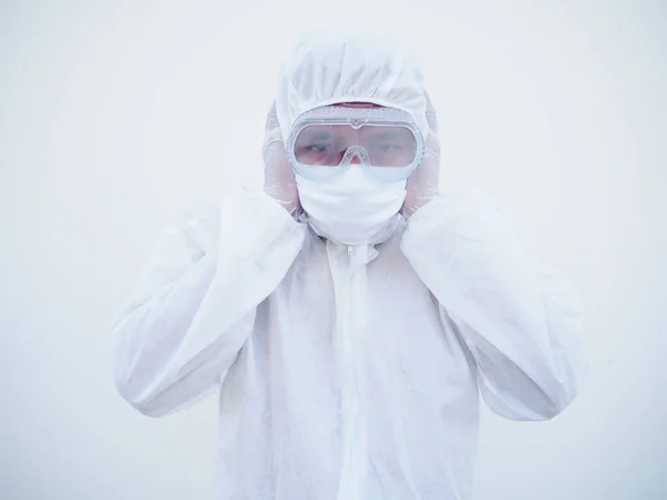 Asian doctor or scientist in PPE suite uniform covers ears with hands. Danger of coronavirus or COVID-19 concept isolated white background