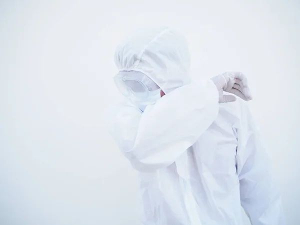 Asian male doctor or scientist in PPE suite uniform showing that feeling strees and sad. coronavirus or COVID-19 concept isolated white background