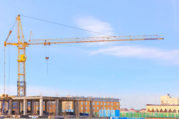 View of the construction site. Tower crane at a construction site. Monolithic frame of the building — Stock Image View Construction Site Tower Crane Construction Site Monolithic Frame Building Royalty Free Stock Photos