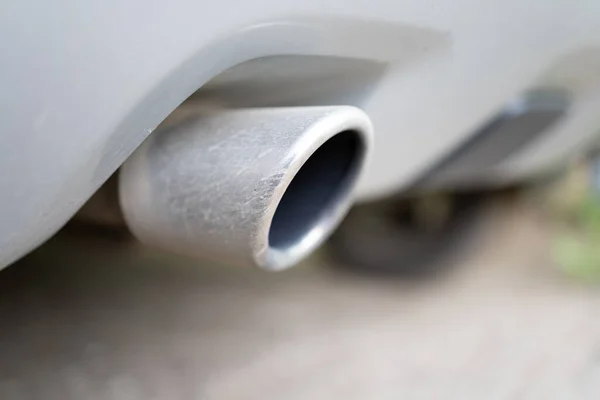 Image of the exhaust pipe of a car. Concept ecology, exhaust, air pollution. Closeup