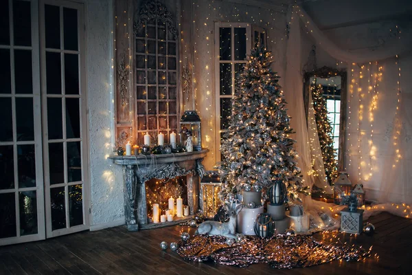 Warm and cozy evening in Christmas room interior design, Christmas tree decorated with lights, living room.magic in new year