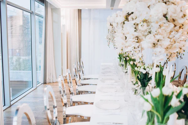 Stock image interior with beautiful wedding table with white flowers