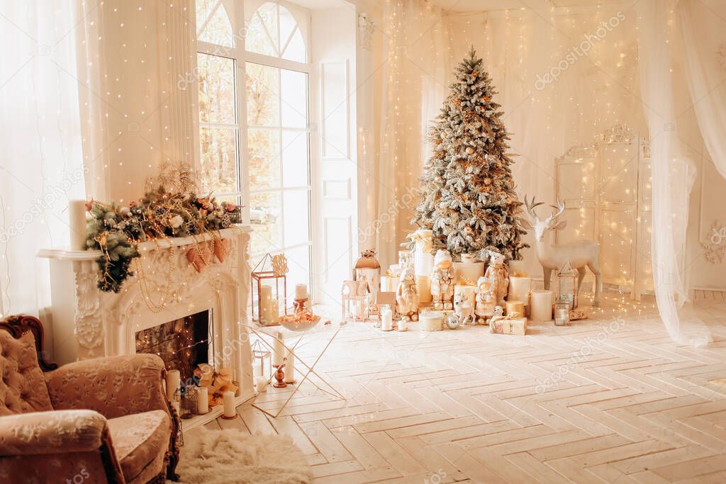 Warm and cozy morning in Christmas interior design, Xmas tree decorated by lights presents, gifts, toys, deer, candles, lanterns, garland lighting, indoors fireplace.
