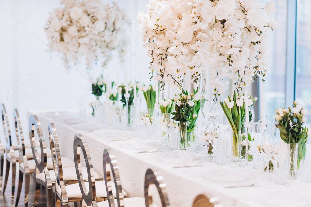 interior with beautiful wedding table with white flowers