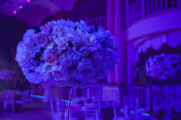 interior of luxury beautiful wedding room with light, tables and chairs