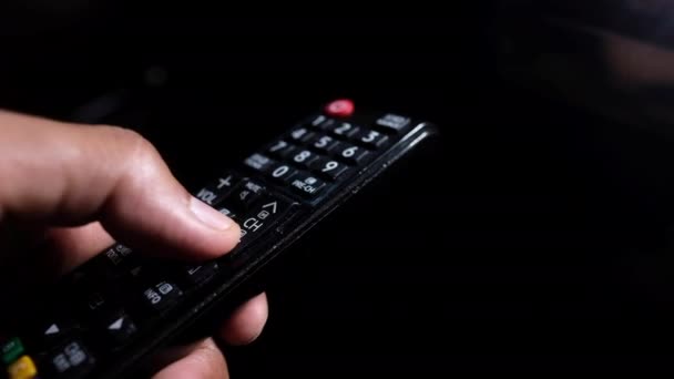 Close up of man hand tv remote. — стоковое видео