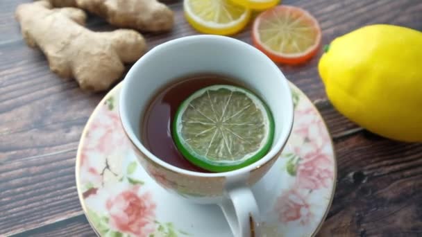 Top view of ginger tea on wooden background.