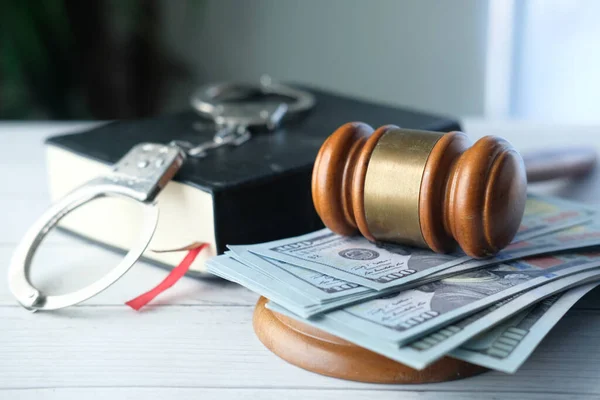 Gavel, cash and handcuff on table, close up — Stock Photo, Image