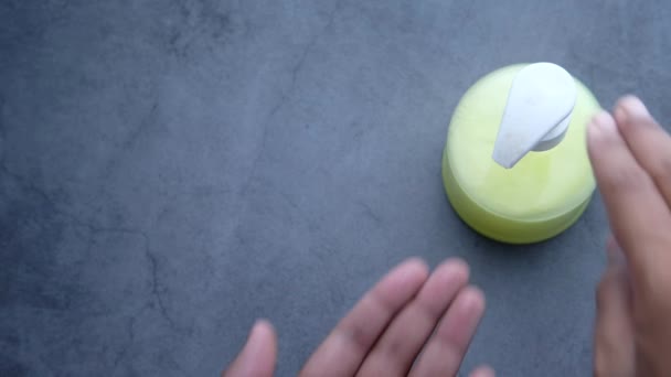 Close up of man hand using sanitizer gel isolated on black — Stock Video