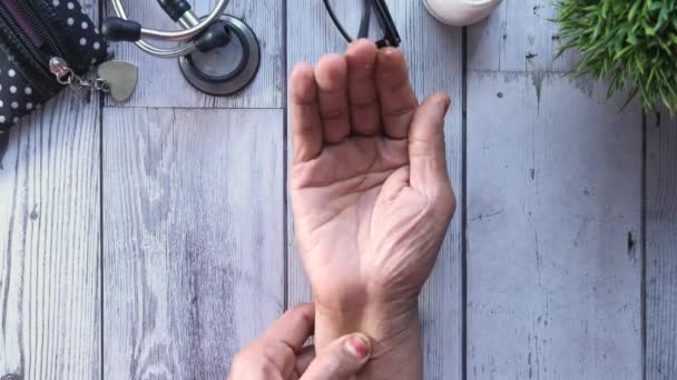 Elderly woman suffering from pain, Top view — Stock Video