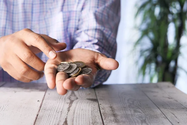 Close up of man hand counting coins — Stock Photo, Image