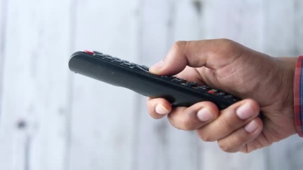 Close up of man hand tv remote. — стоковое видео