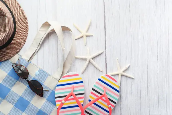 Flat composition of summer beach accessories on table. — Stock Photo, Image