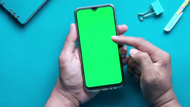 Top view of man hand using smart phone on office desk — Stock Video