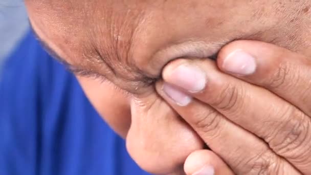 Close up of upset man suffering from strong eye pain — Stock Video