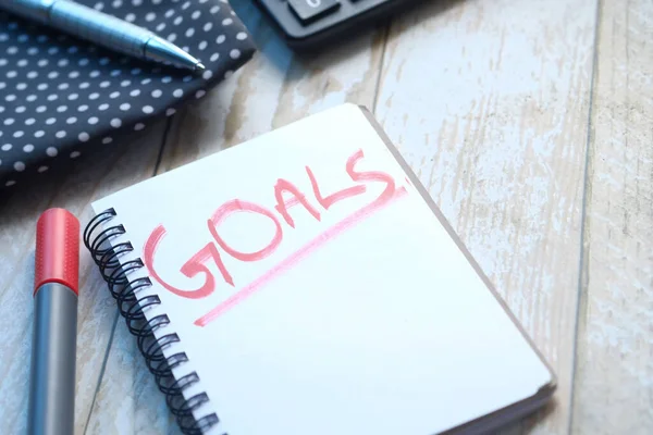 Top view of new year goals text on notepad. — Stock Photo, Image