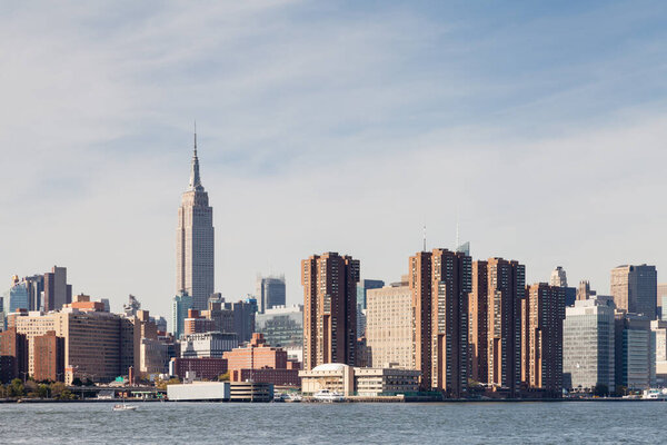 Midtown Manhattan as viewed from the East River, New York City in the United States of America. The Empire State Building stands above the surrounding buildings.