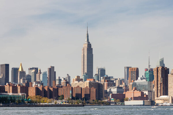 Midtown Manhattan as viewed from the East River, New York City in the United States of America. The Empire State Building stands above the surrounding buildings.