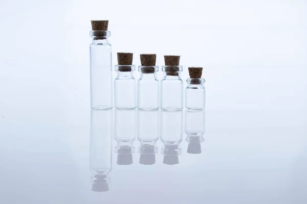 Empty Small Glass Transparent Flask Bottles Sealed Wooden Stoppers Objects — Stock Photo, Image