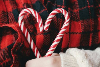 Low Section of Woman Holding Christmas Heart Ornament Festive Holiday Lifestyle Winter Season Celebration Decoration Concept