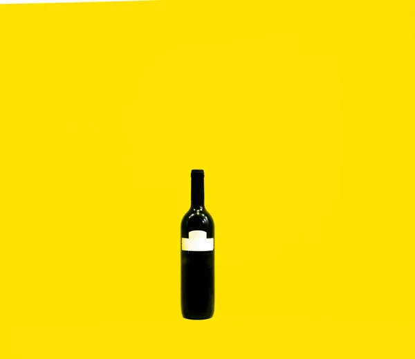 Isolated Black Wine Bottle Blank White Label Standing Isolated Yellow — Stock Photo, Image