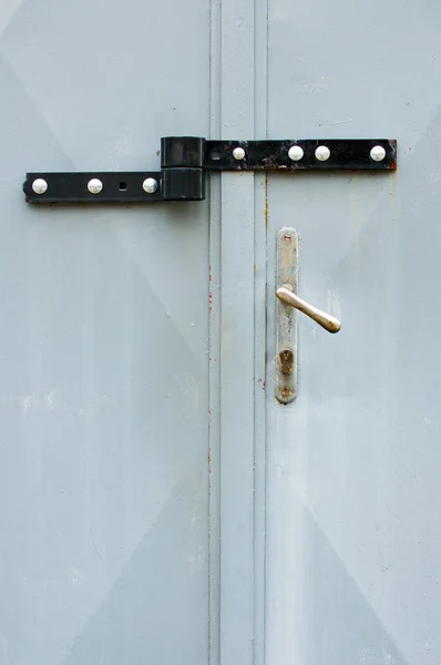 Picture of locked hasp on grey metal gate - Image. Front view on locked garage gate — Stock Photo, Image