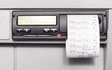 Digital tachograph and print of the driving time of the day. No personal data clipart