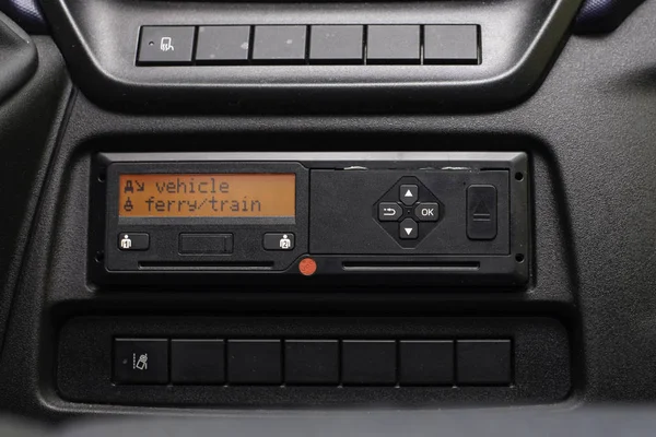 Digital tachograph display reads Vehicle Ferry Train. No personal data. Tachograph in a van — Stock Photo, Image