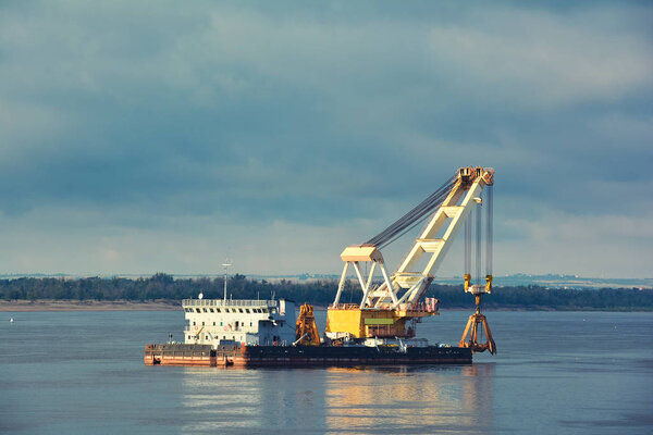 Barge crane on the river