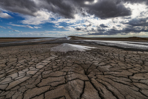 Mud volcanoes, cracked earth