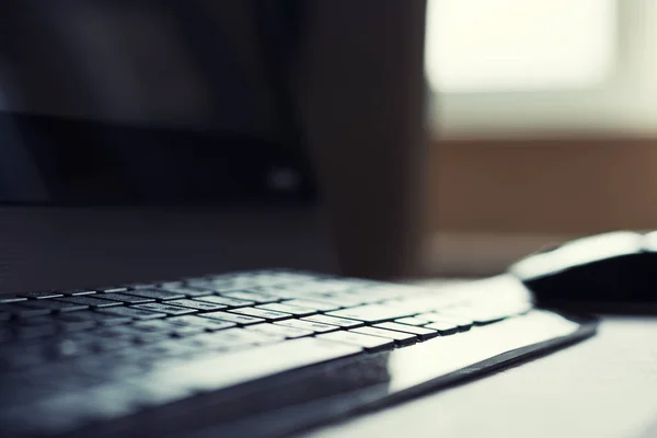 Personal computer on desk, selective focus