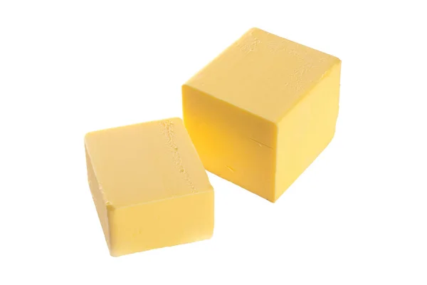 Kousek másla na bílém pozadí — Stock fotografie