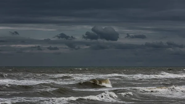 Storm at sea, big foamy waves