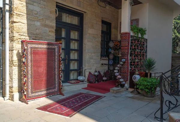 Sale of old carpet and souvenirs in eastern city