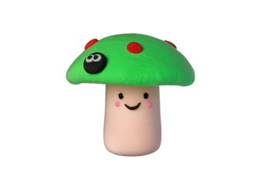 Beyaz arka planda neşeli bir mantar. Yumuşak plastikçilik