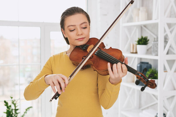 Concentrated girl repeating her performance