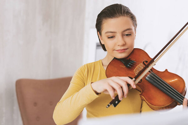 Close up of attentive musician that holding bow