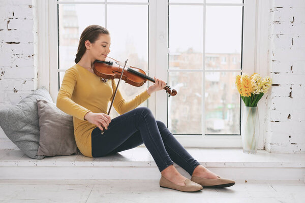 Romantic girl enjoying her playing