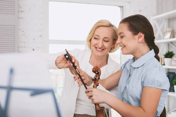Cheerful woman communicating with her student — Stock Photo, Image