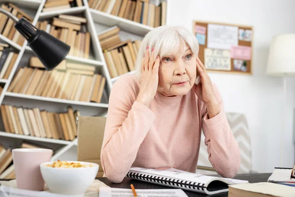 Sad mature woman exhausting from learning — Stock Photo, Image