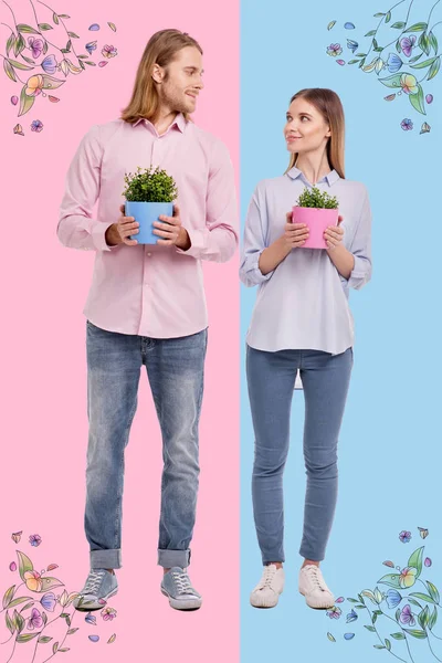 Eco activists looking at each other and growing flowers — Stock Photo, Image