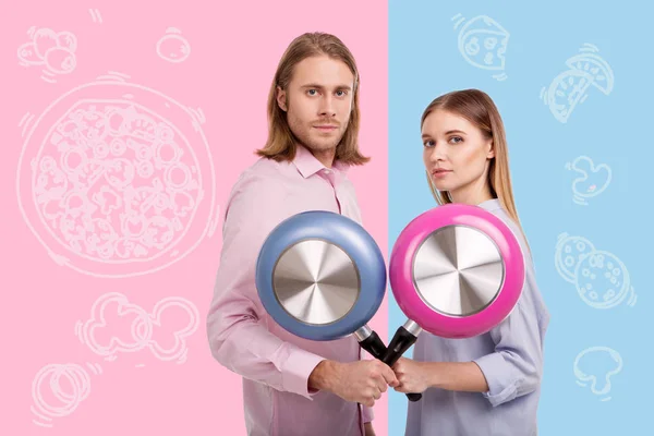 Man and his wife enjoying cooking and showing new frying pans — Stock Photo, Image