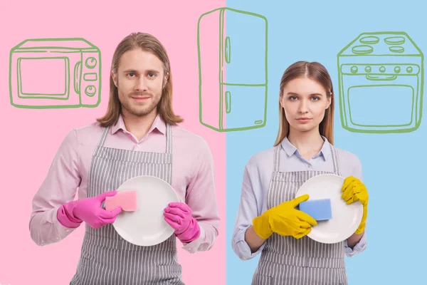 Serious young woman looking satisfied while washing the dishes with her brother — Stock Photo, Image